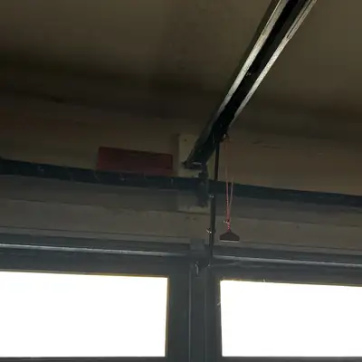 Broken torsion spring above windows
